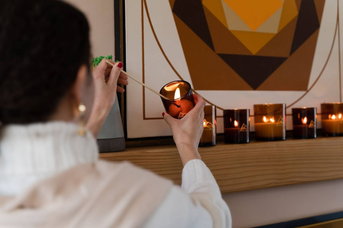 a female holding a candle in her hands